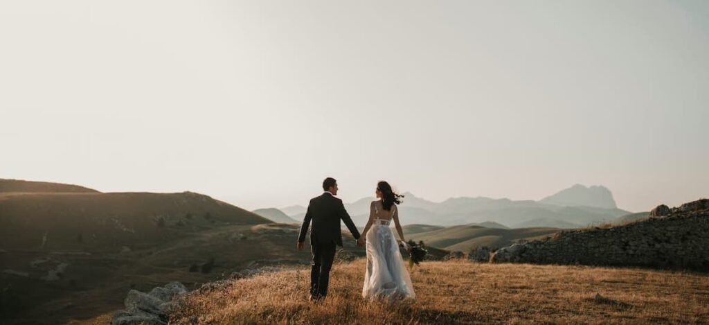 bride and groom taking wedding photo in nature